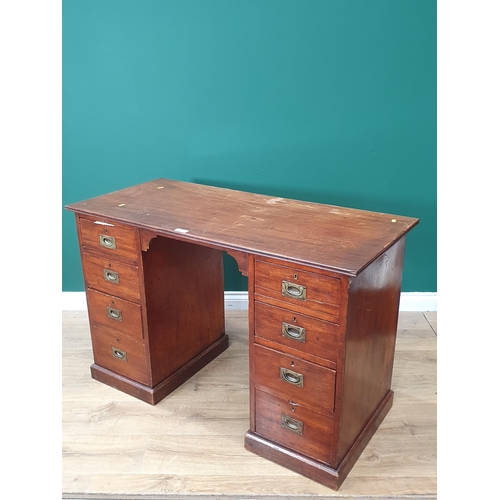 590 - An antique mahogany Campaign style Pedestal Desk fitted four drawers each side with brass inset hand... 