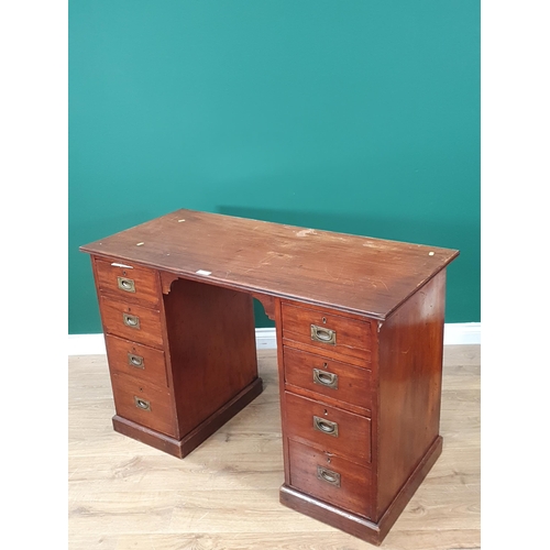 590 - An antique mahogany Campaign style Pedestal Desk fitted four drawers each side with brass inset hand... 