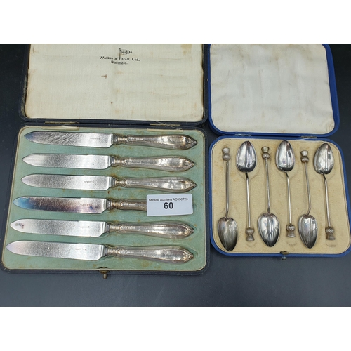 60 - Six George V silver and enamel Coffee Spoons with thistle finials, Birmingham 1929, A/F, in case, an... 