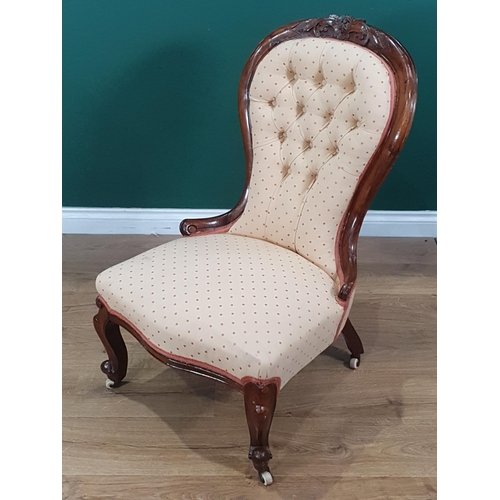 602 - A Victorian walnut framed spoon back Chair with cream button upholstery