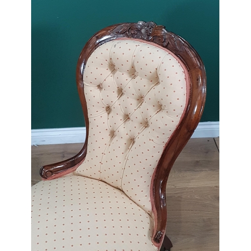 602 - A Victorian walnut framed spoon back Chair with cream button upholstery