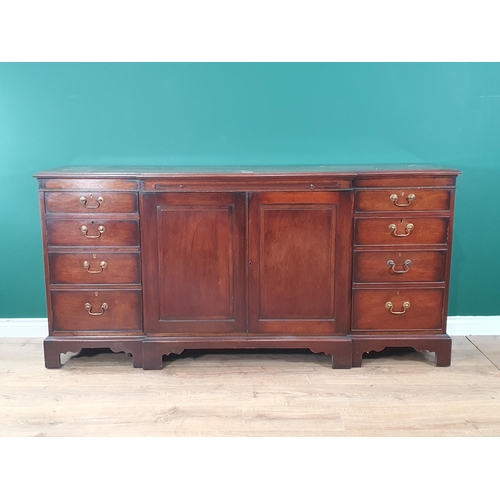 604 - A Georgian style mahogany Breakfront Sideboard fitted eight drawers flanking brushing slide and pair... 