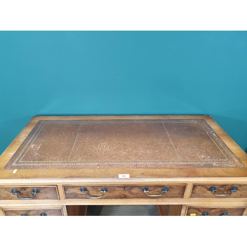 605 - A yew wood veneered Pedestal Desk fitted nine drawers 4ft W x 2ft 6in H