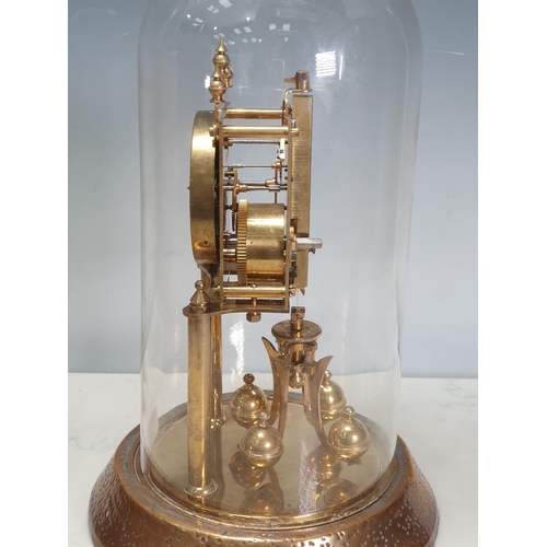 615 - A brass Mantle Clock under glass dome 1ft H