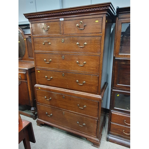 651 - A 19th Century oak Chest on Chest of two short and five long drawers, having dentil cornice and rais... 