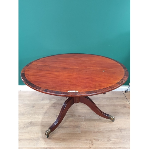 668 - A 19th Century mahogany and rosewood crossbanded circular Breakfast Table on turned column and out s... 