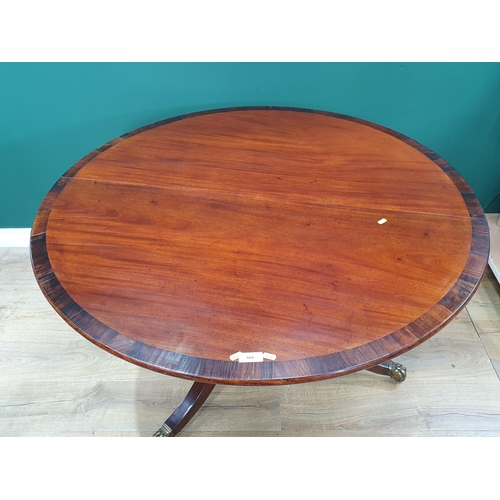 668 - A 19th Century mahogany and rosewood crossbanded circular Breakfast Table on turned column and out s... 