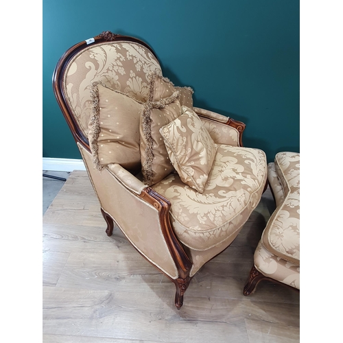 700 - A French style Armchair with gold leafage upholstery and matching Footstool