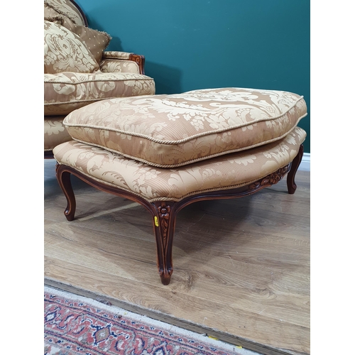 700 - A French style Armchair with gold leafage upholstery and matching Footstool