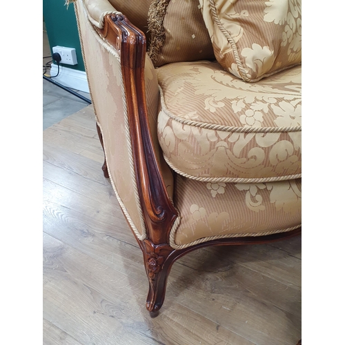700 - A French style Armchair with gold leafage upholstery and matching Footstool