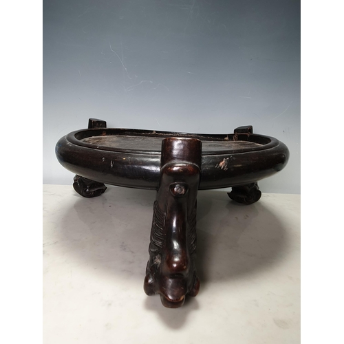 737 - A Chinese hardwood circular Stand on paw feet,  15in Diam