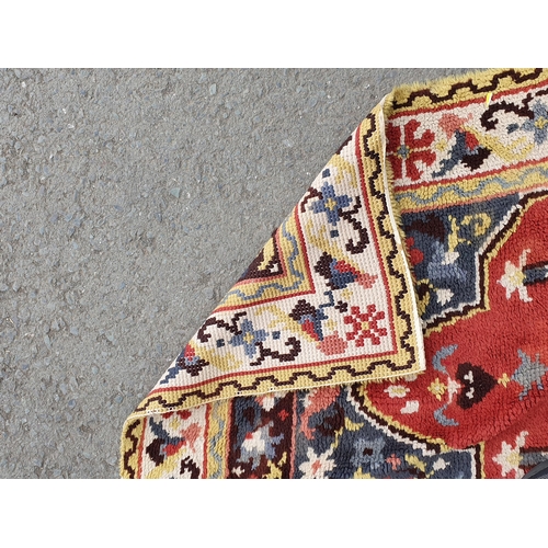 738 - A bordered Prayed Rug with stylised floral border and central red ground, 5ft 5in x 3ft 8in