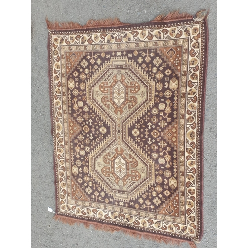 741 - A small Persian Rug on a brown ground, 5ft 8in x 4ft 2in and a small cotton Rug depicting deer besid... 