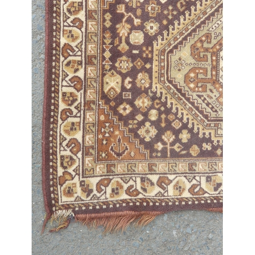 741 - A small Persian Rug on a brown ground, 5ft 8in x 4ft 2in and a small cotton Rug depicting deer besid... 