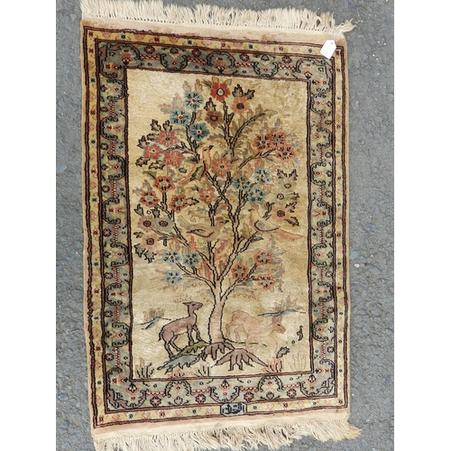 741 - A small Persian Rug on a brown ground, 5ft 8in x 4ft 2in and a small cotton Rug depicting deer besid... 