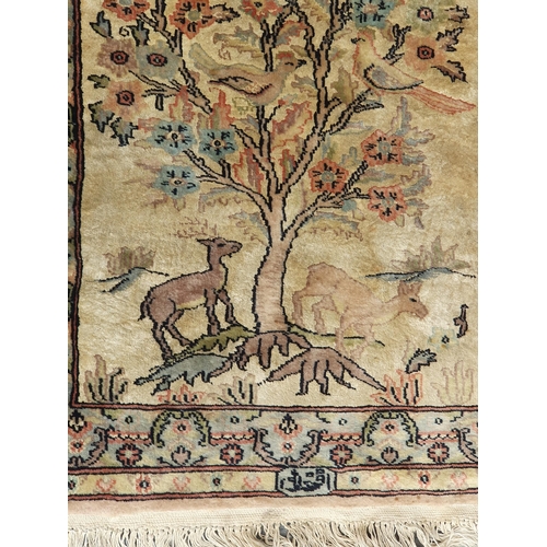 741 - A small Persian Rug on a brown ground, 5ft 8in x 4ft 2in and a small cotton Rug depicting deer besid... 