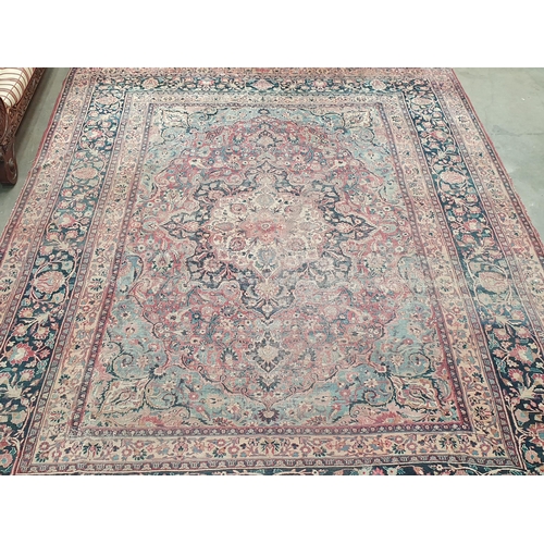 747 - A Persian Carpet of multi-bordered design, decorated scrolls and floral motifs on a blue and red gro... 