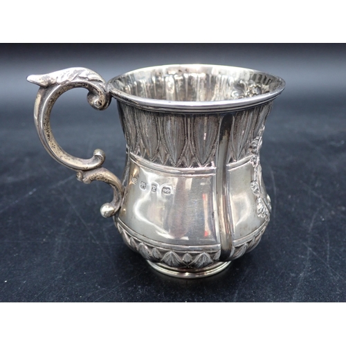 77 - A Victorian silver Christening Mug with leafage friezes, engraved initials within floral cartouche, ... 