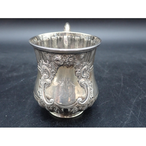 77 - A Victorian silver Christening Mug with leafage friezes, engraved initials within floral cartouche, ... 