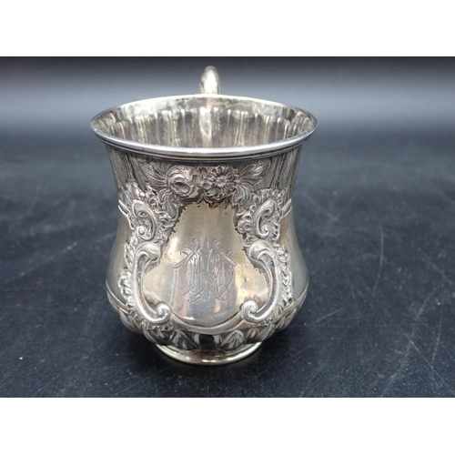 77 - A Victorian silver Christening Mug with leafage friezes, engraved initials within floral cartouche, ... 