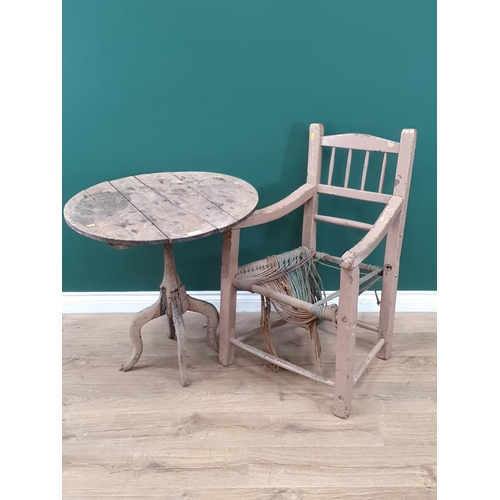 8 - An Irish painted Sugan Elbow Chair and a rustic oak Pillar Table.