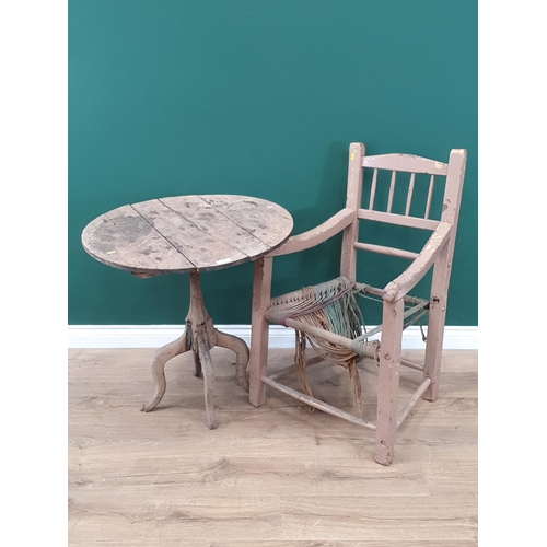 8 - An Irish painted Sugan Elbow Chair and a rustic oak Pillar Table.