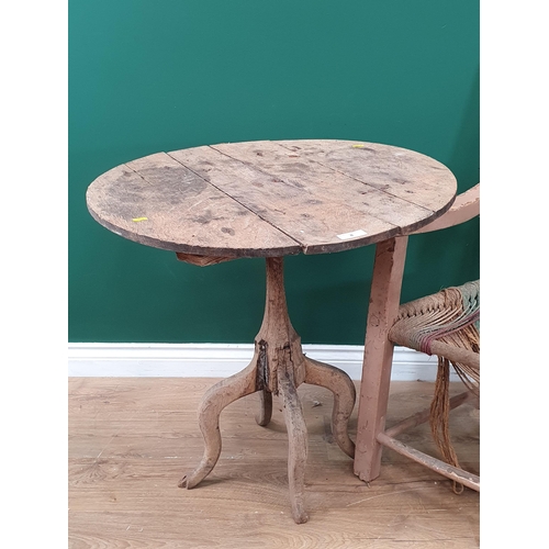 8 - An Irish painted Sugan Elbow Chair and a rustic oak Pillar Table.