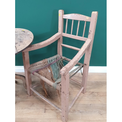 8 - An Irish painted Sugan Elbow Chair and a rustic oak Pillar Table.