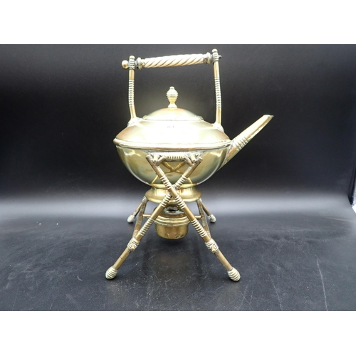 81 - An Arts & Crafts brass Kettle on X frame stand complete with spirit burner Rd No 1764-55 small repai... 