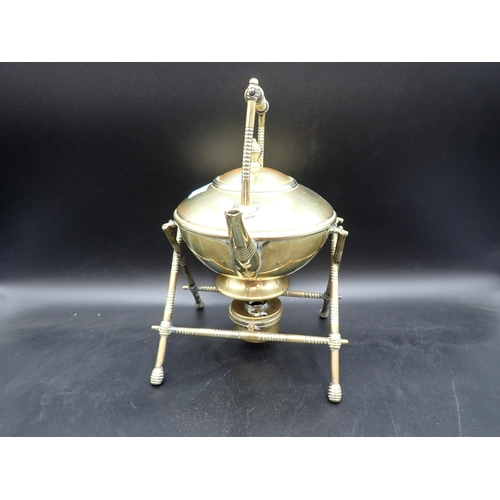 81 - An Arts & Crafts brass Kettle on X frame stand complete with spirit burner Rd No 1764-55 small repai... 