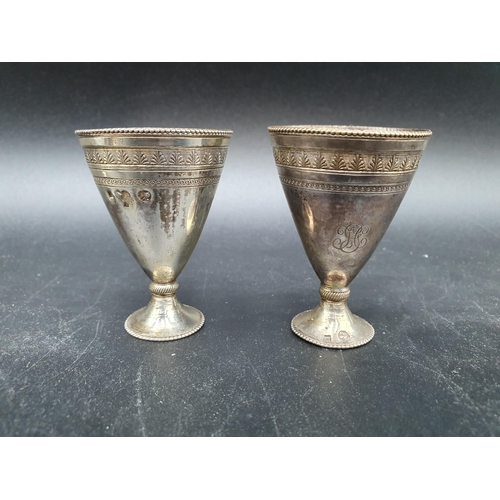 93 - A Set of six Egyptian silver Zarfs of conical form with leafage and beaded friezes on spreading base... 