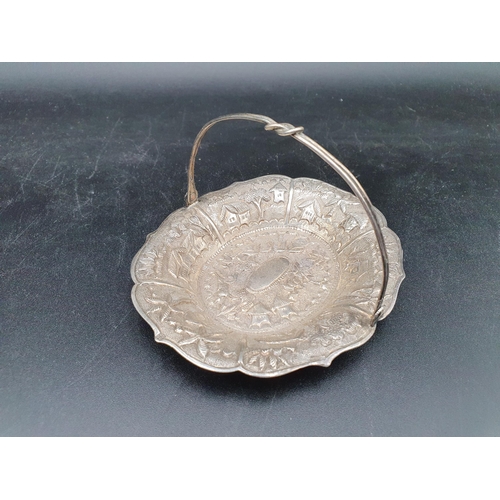 95 - An Indian silver oval Basket embossed and chased with animal and landscape, swing handle