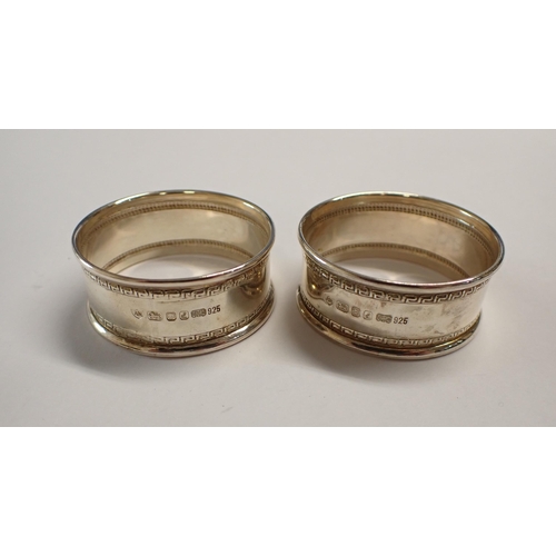 98 - A pair of modern silver Napkin Rings, London 1985, cased