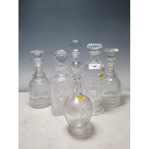 748 - Six assorted cut glass Decanters and stoppers