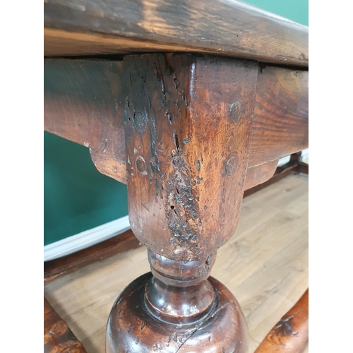 770 - An antique oak Refectory Table with 17th Century elements, having a three plank cleated top, raised ... 