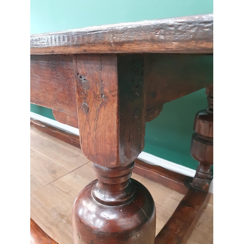 770 - An antique oak Refectory Table with 17th Century elements, having a three plank cleated top, raised ... 