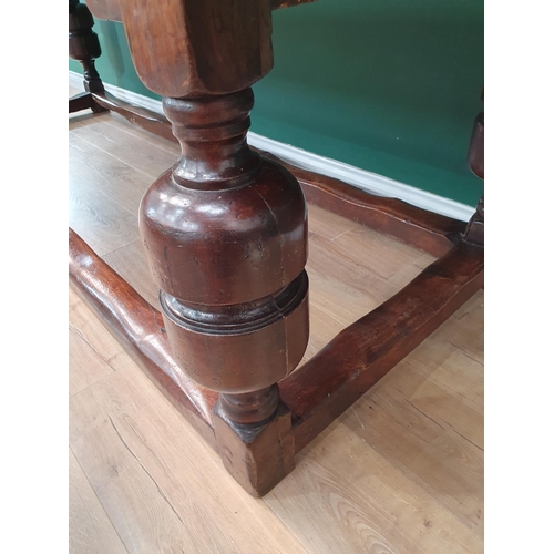 770 - An antique oak Refectory Table with 17th Century elements, having a three plank cleated top, raised ... 