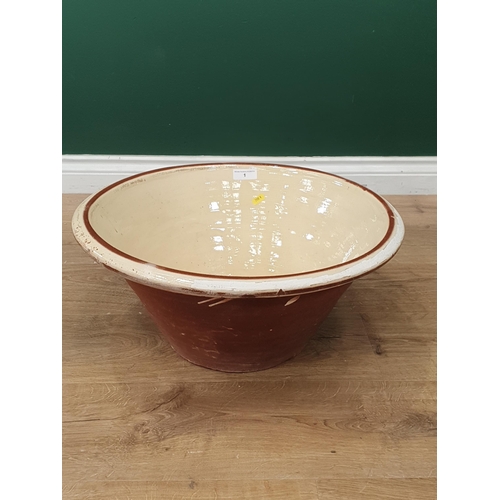 1 - A Terracotta cream glazed Dairy Bowl, (glaze worn in places), 20