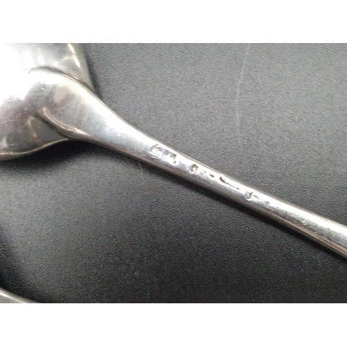 132 - A pair of Georgian bottom marked Table Spoons, old English pattern, marks worn, another, London 1790... 