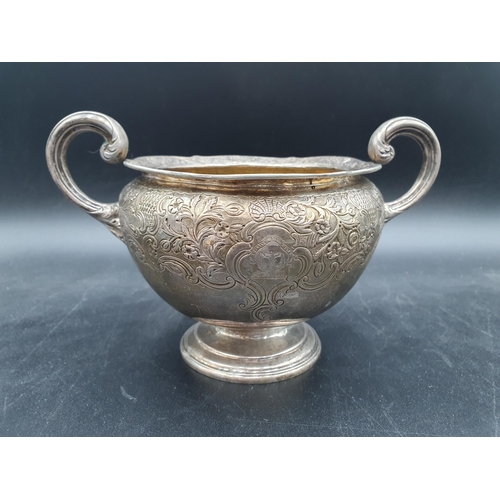 136 - A Wm IV silver two handled Sugar Bowl and Milk Jug with floral and leafage decoration engraved crest... 