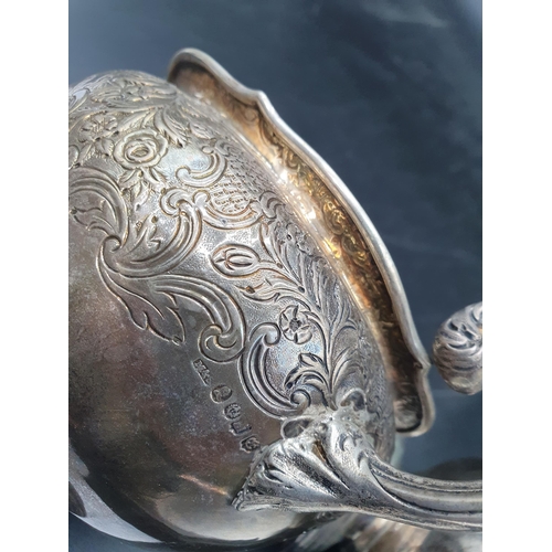 136 - A Wm IV silver two handled Sugar Bowl and Milk Jug with floral and leafage decoration engraved crest... 