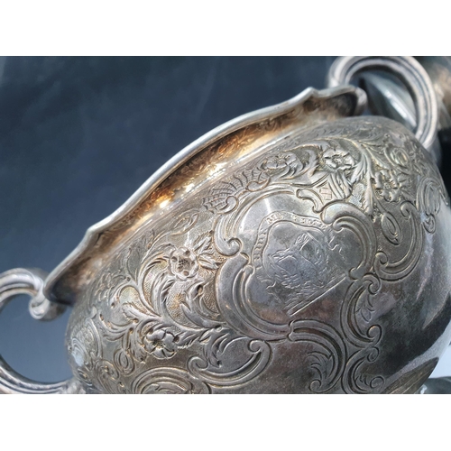 136 - A Wm IV silver two handled Sugar Bowl and Milk Jug with floral and leafage decoration engraved crest... 