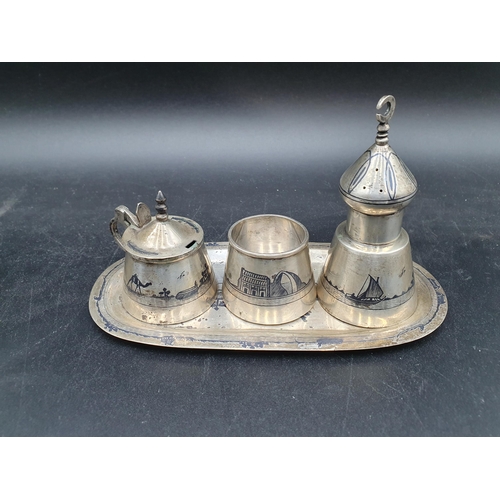 141 - A Niello three piece Condiment Set on oval Tray decorated camels, sailing vessels, etc, and six silv... 