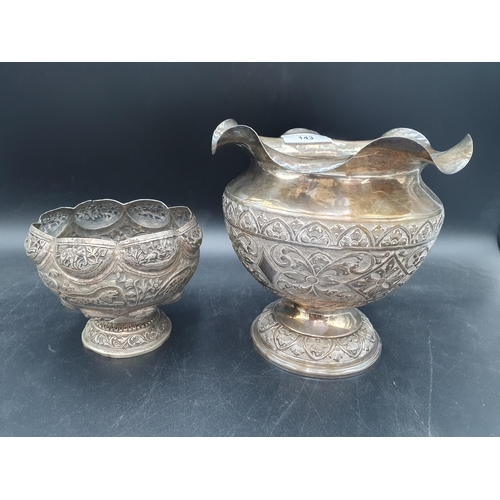 143 - An Indian silver Bowl embossed frieze of animals, 5in, and a white metal Pedestal Bowl with leafage ... 