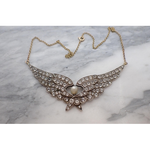 152 - A Necklace formed as outstretched wings set numerous paste and single river pearl on fine gold chain