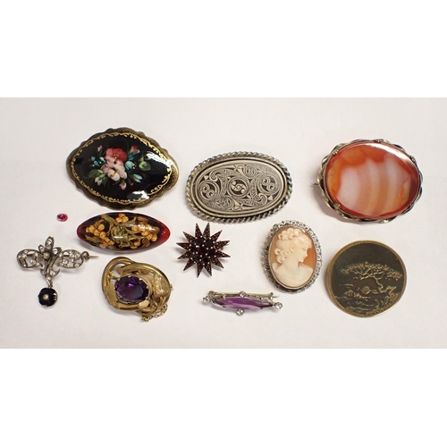 165 - A collection of vintage Brooches including; carved shell cameo, garnet, paste-set, unmounted pink st... 