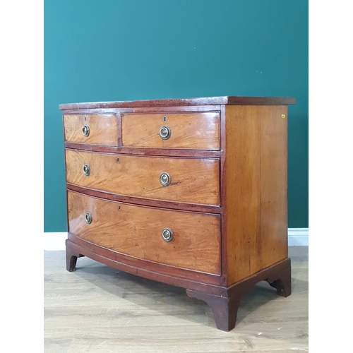 17 - A bow front flamed mahogany Chest of two short, two long Drawers on bracket feet, A/F, 2ft 7