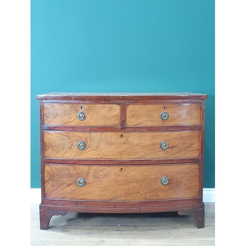 17 - A bow front flamed mahogany Chest of two short, two long Drawers on bracket feet, A/F, 2ft 7