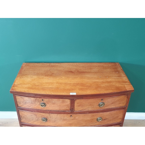 17 - A bow front flamed mahogany Chest of two short, two long Drawers on bracket feet, A/F, 2ft 7