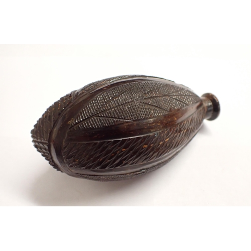 187 - A carved coquilla nut Flask, 5 1/2in